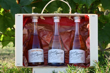 Load image into Gallery viewer, The perfect trio of drinks: our award winning classic French gin, raspberry-filled Rosé Gin and our cocktail, the Negroni by Saint Amans in a lovely case, in our garden. French: Le trio parfait de boissons : notre classique gin français médaillé, notre Gin Rosé infusé aux framboises et notre cocktail, le Negroni par Saint Amans dans une jolie caisse, dans notre jardin.
